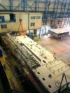 Overhead view of a ship under construction in a shipyard.