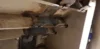 Welded metal joints on the interior surface of a structure, with visible markings and welding residue.