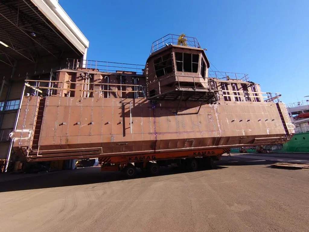 Large unfinished ship superstructure.