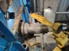 Industrial robotic arm performing maintenance.